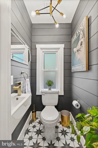 a bathroom with a sink toilet and tub
