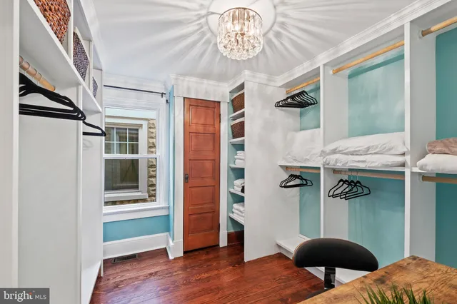 a view of a livingroom with furniture and a window