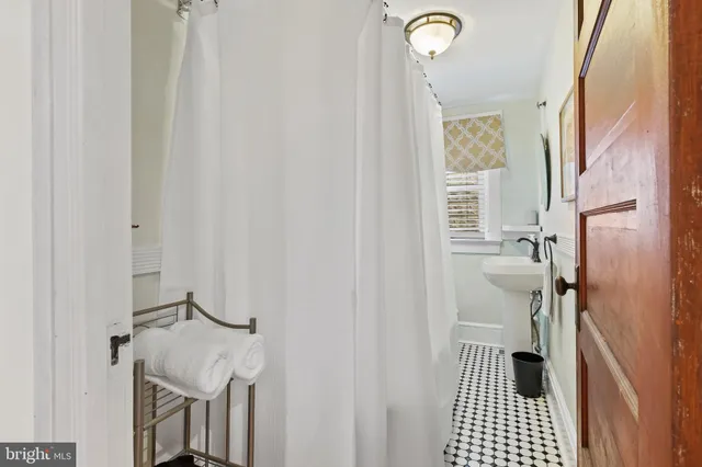 a bathroom with a sink and a shower