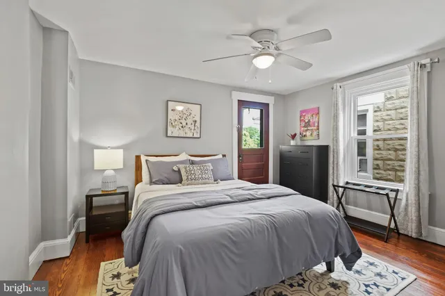 a bed room with a bed and a chandelier