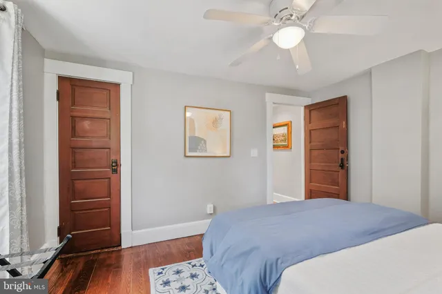 a bedroom with a bed and a dresser