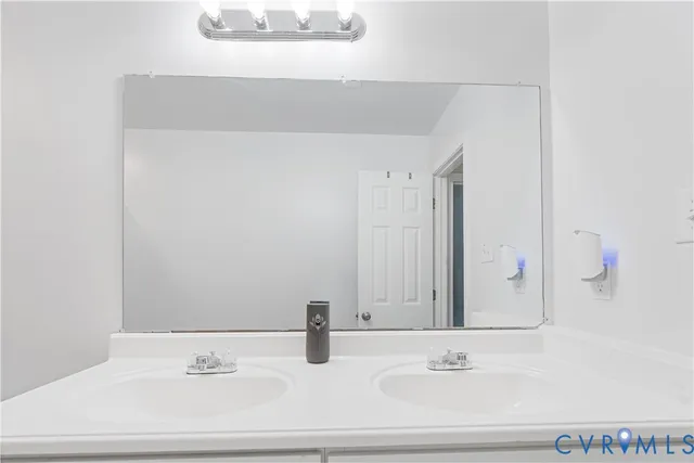 a bedroom with a bed and a ceiling fan