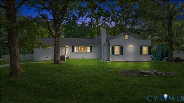 a kitchen with a sink a stove and wooden floor
