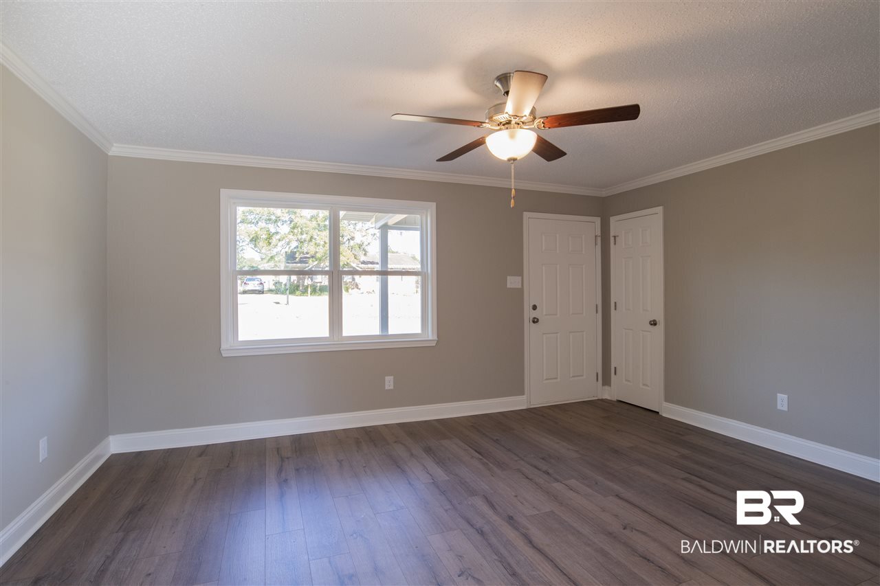 9141 Semmes Court Semmes, AL 36575 - Photo 3 of 28 Thurma-Tru exterior door and vinyl plank flooring.
