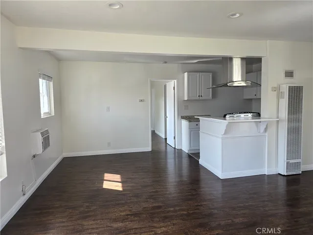 a view of kitchen with cabinets and wooden floor