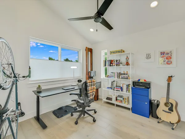 a view of a workspace with furniture