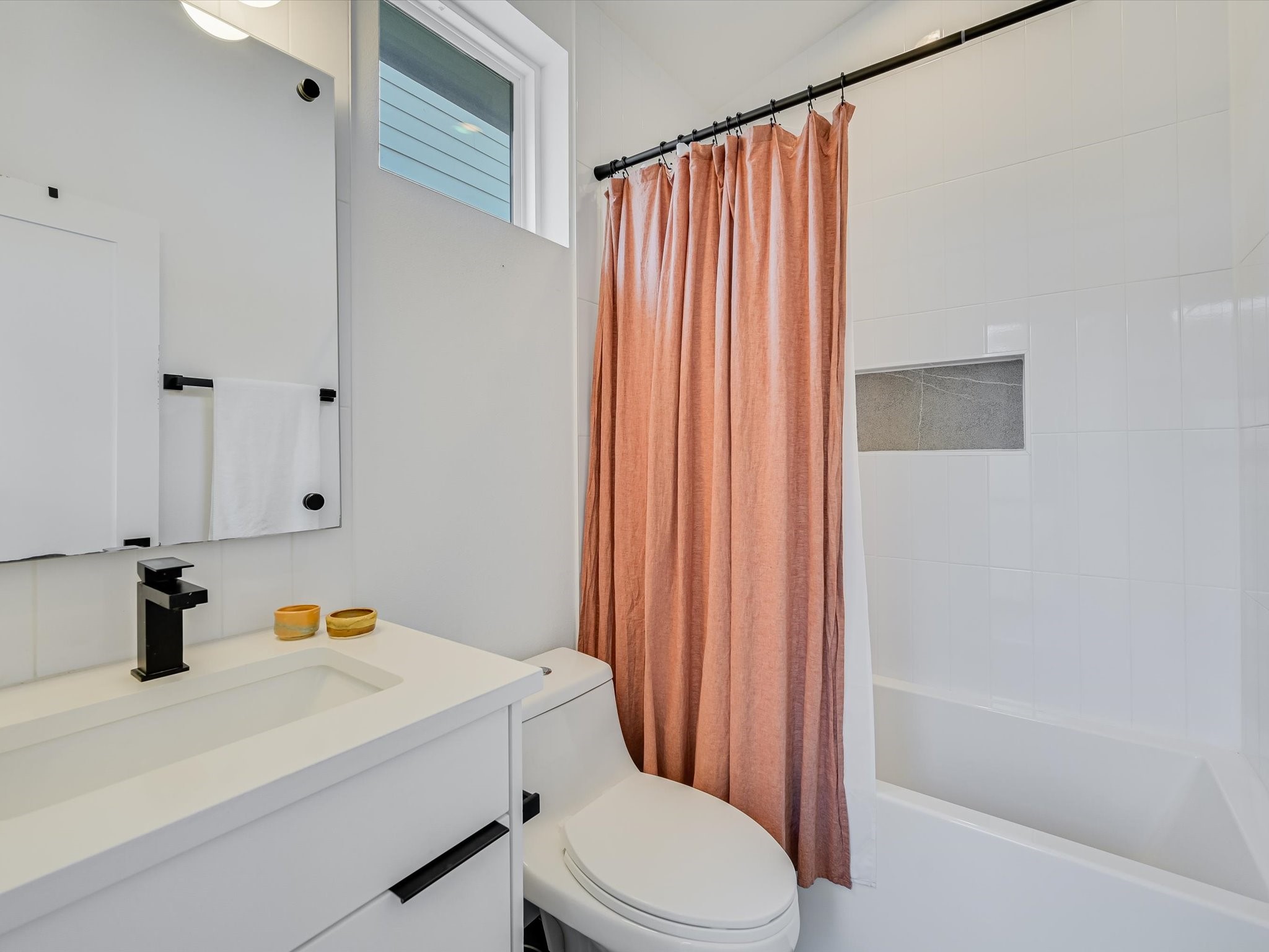 5603 Samuel Huston Avenue, Unit 1 Austin, TX 78721 - Photo 28 of 39 a bathroom with a sink toilet and shower