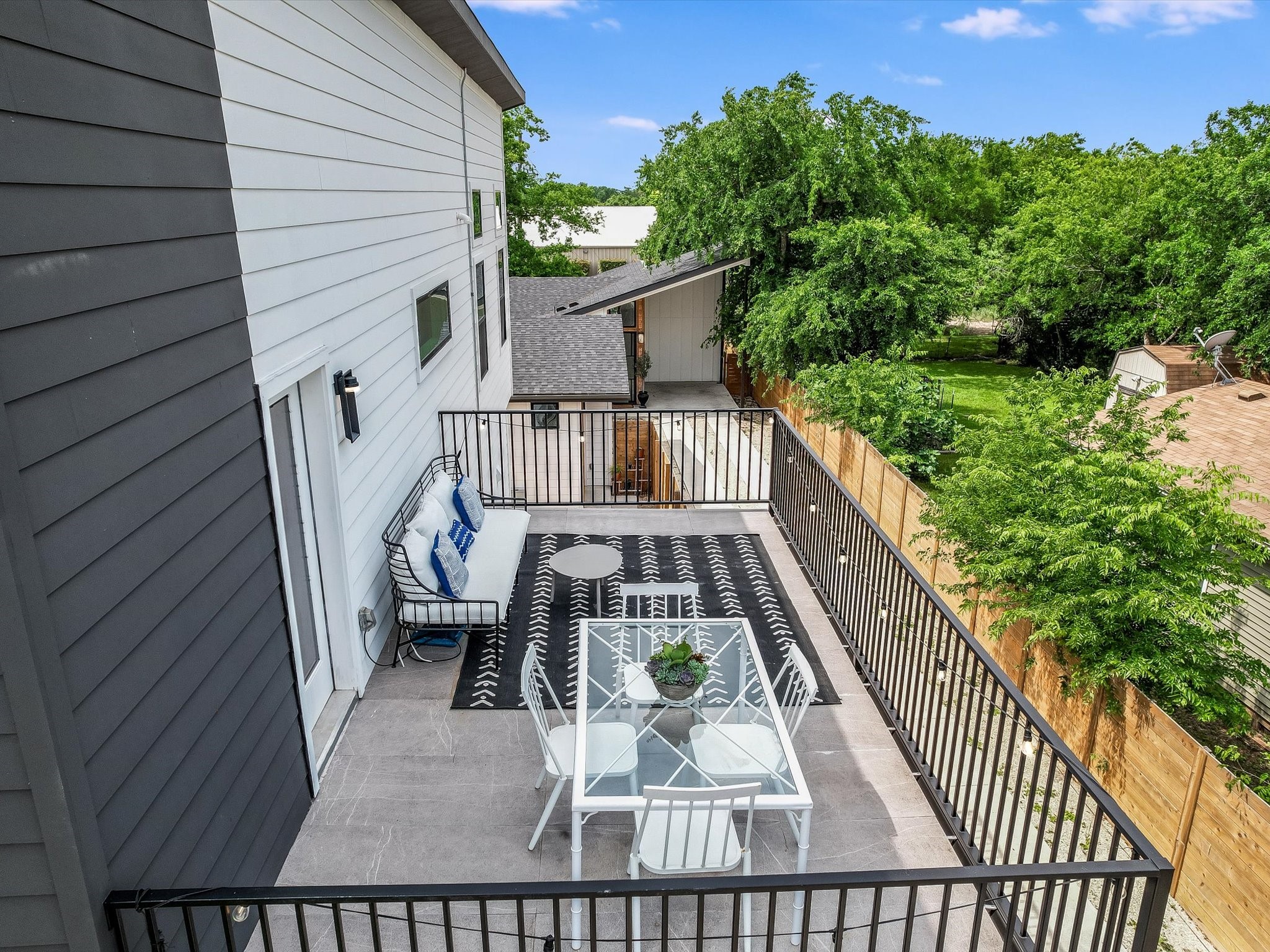 5603 Samuel Huston Avenue, Unit 1 Austin, TX 78721 - Photo 33 of 39 a view of balcony with wooden floor and fence and a potted plant