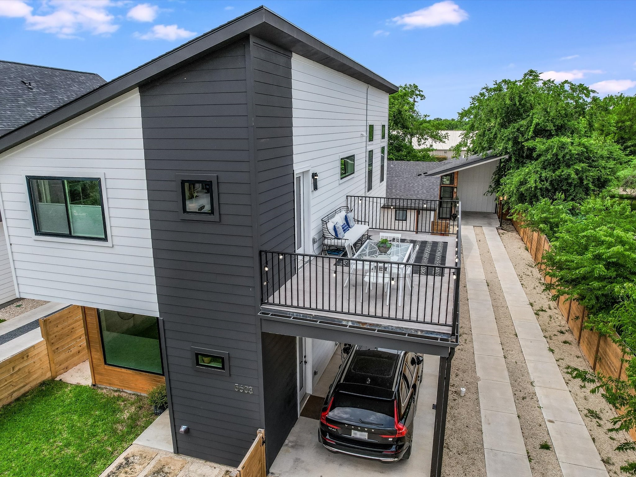 5603 Samuel Huston Avenue, Unit 1 Austin, TX 78721 - Photo 34 of 39 a view of a house with wooden deck and furniture