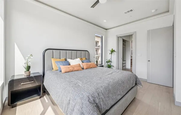 a bedroom with a bed and a couch