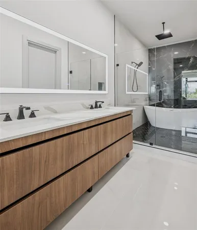 a bathroom with a double vanity sink and mirror
