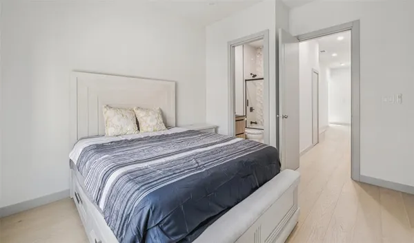 a bedroom with a bed and closet