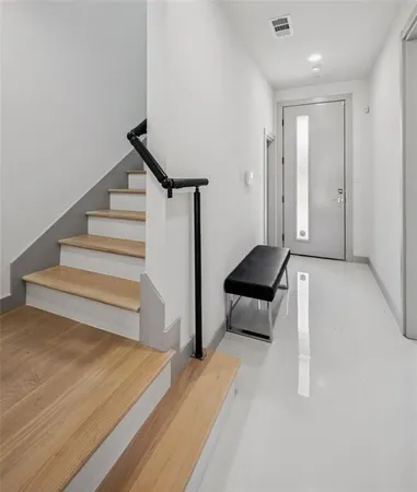 a living room with furniture and a ceiling fan