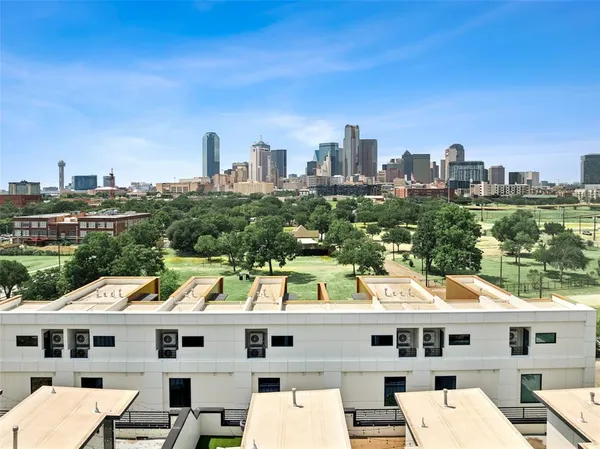 a aerial view of a large building with a city view