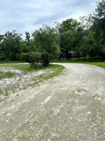 a view of backyard with green space