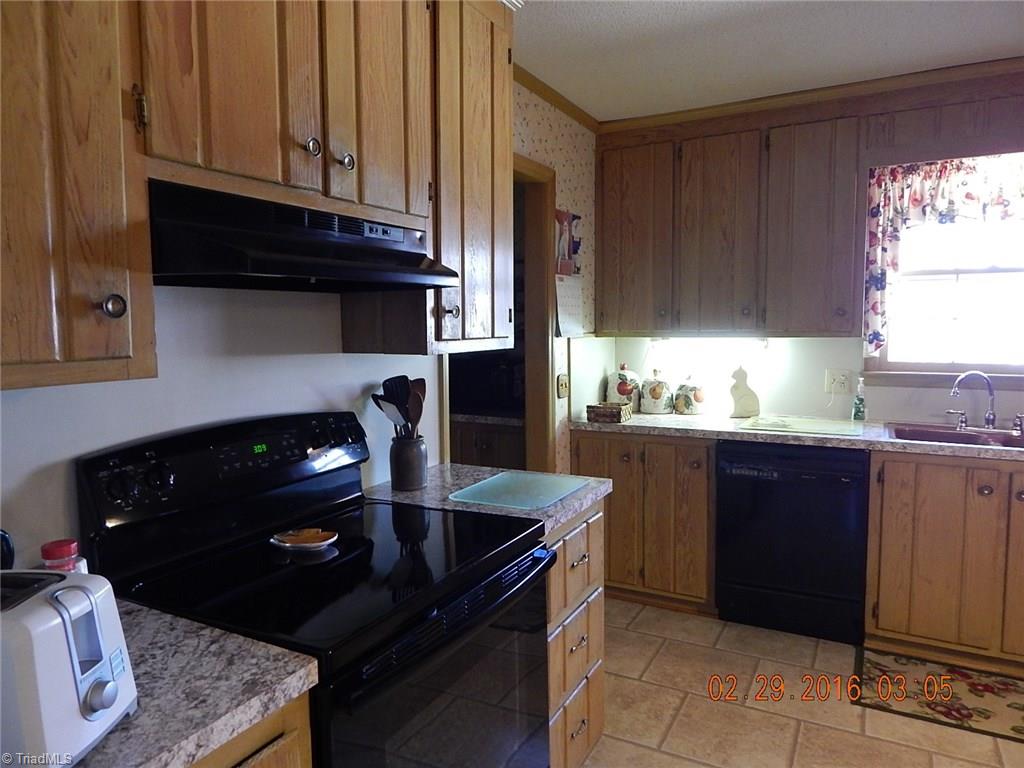 433 Hartgrove Road King, NC 27021 - Photo 5 of 26 Lots of cabinets and counter space.
