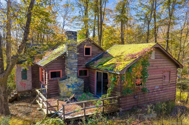 a view of house with a chairs in patio