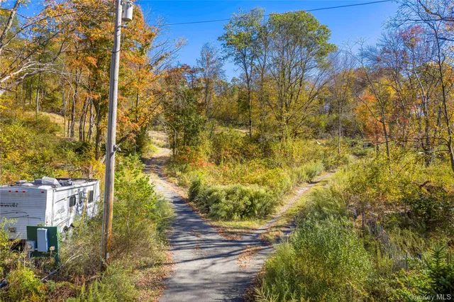 a view of residential houses with yard