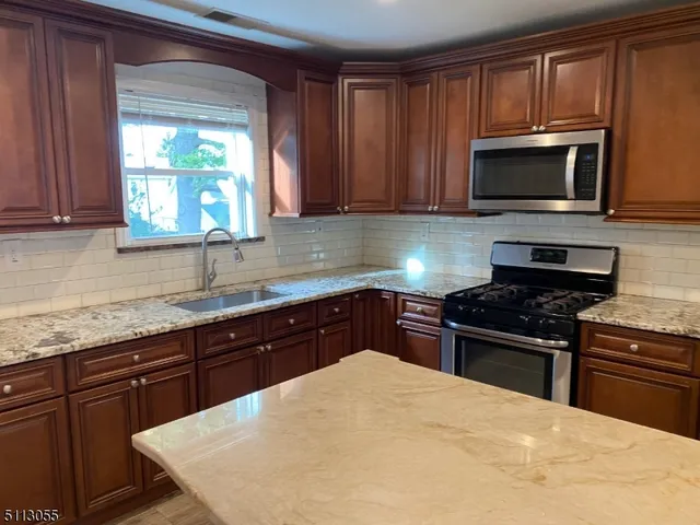 a kitchen with a stove and a microwave