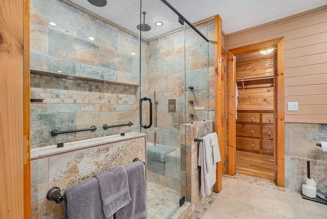 a bathroom with a shower and a sink
