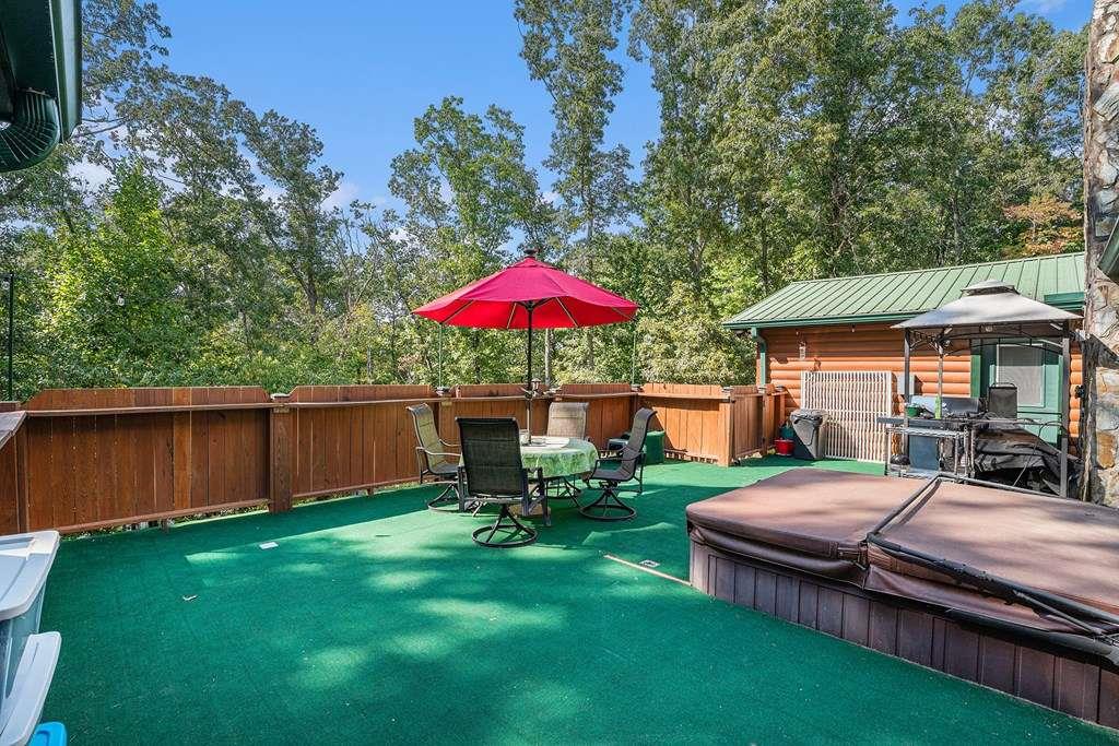 370 Davis Road Blue Ridge, GA 30513 - Photo 40 of 47 a view of a house with backyard sitting area and garden