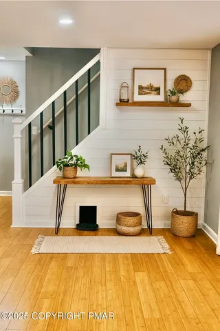 a living room with stainless steel appliances kitchen view and living room view
