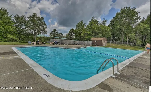 a view of a lake and green valley