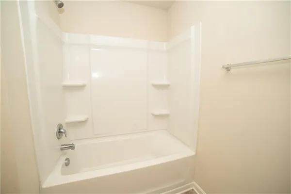 a close up of a bathtub in a bathroom