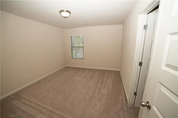 a view of room with window and hardwood floor
