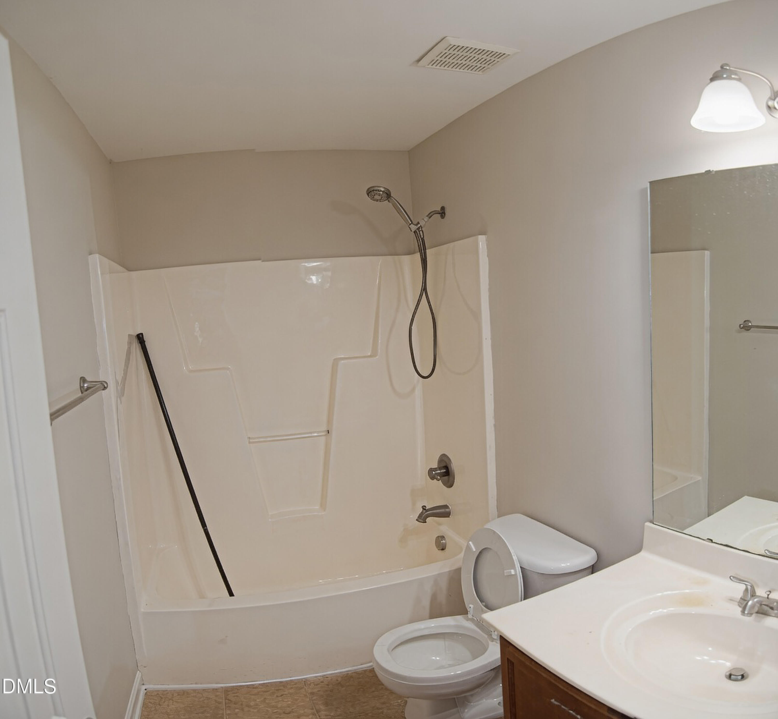 4809 Landover Pine Place Raleigh, NC 27616 - Photo 11 of 14 a bathroom with a toilet sink and shower