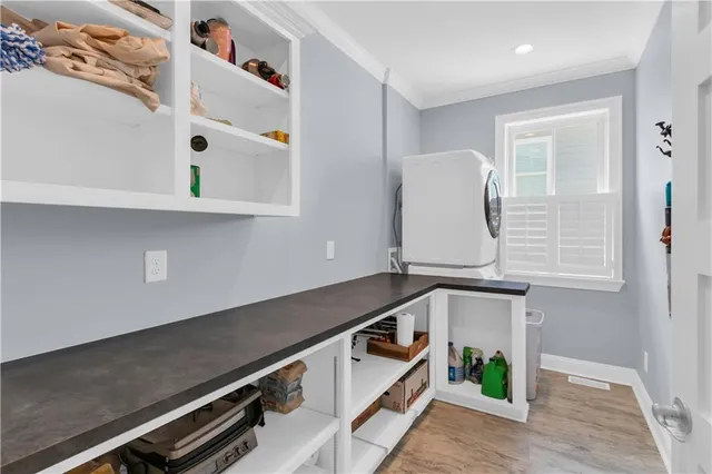 a view of an entryway with wooden floor