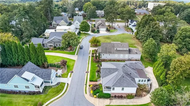 an aerial view of a house with outdoor space pool patio and lake view