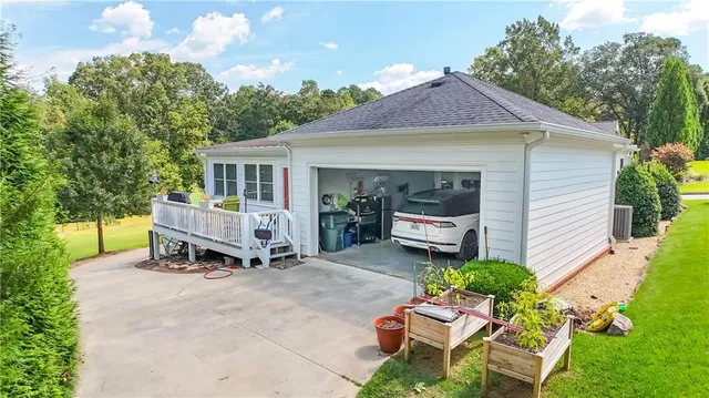 a backyard of a house with table and chairs