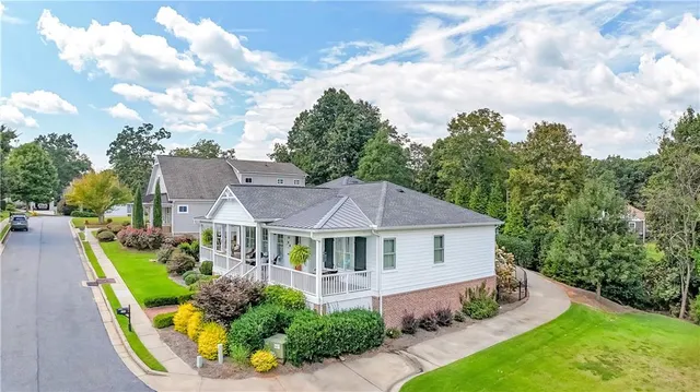 a aerial view of a house with swimming pool and garden