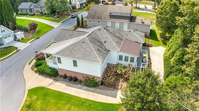 an aerial view of a house with a garden and swimming pool