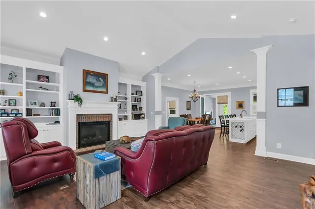 a living room with furniture or flat screen tv and a fireplace