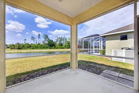 a view of a swimming pool with an outdoor seating