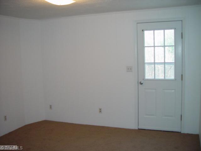 1610 Hauser Road Lewisville, NC 27023 - Photo 11 of 16 3rd Bedroom. Lower level bedroom with exit to lower driveway