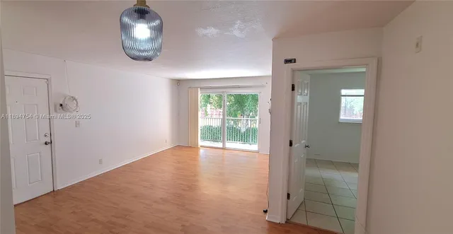 wooden floor in a hall with an entryway
