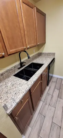 a kitchen with a sink and cabinets