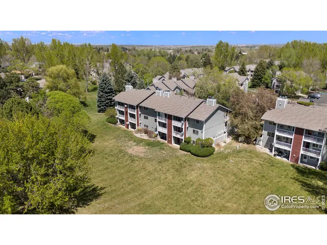 a aerial view of a house with big yard