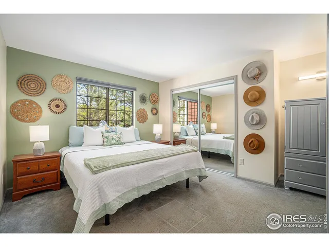 a bedroom with bed and a window