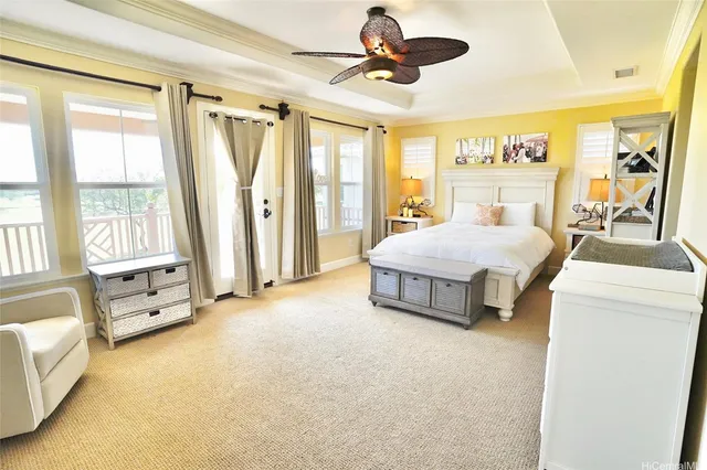 a spacious bedroom with a bed and large windows