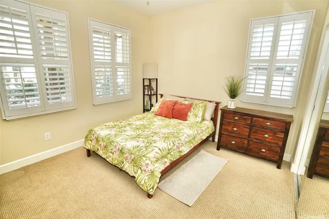 a bedroom with a bed and a cabinets