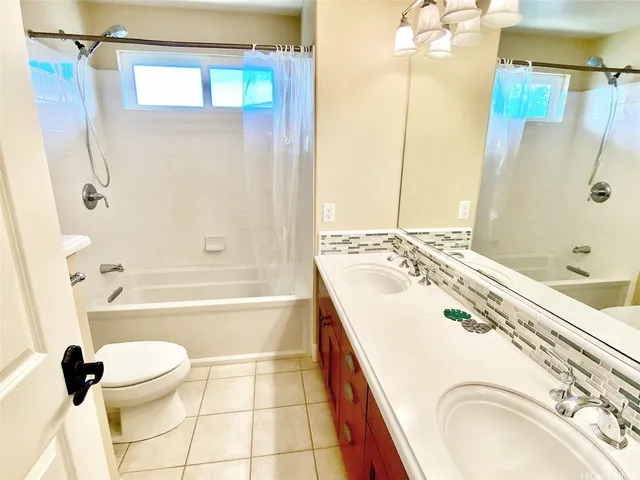 a bathroom with a sink a toilet and a bathtub