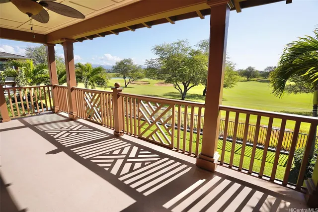 a view of balcony with wooden floor
