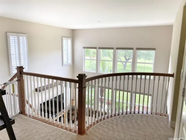 a view of staircase with window