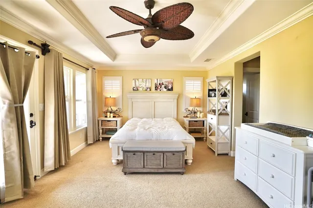 a spacious bedroom with a bed and a chandelier