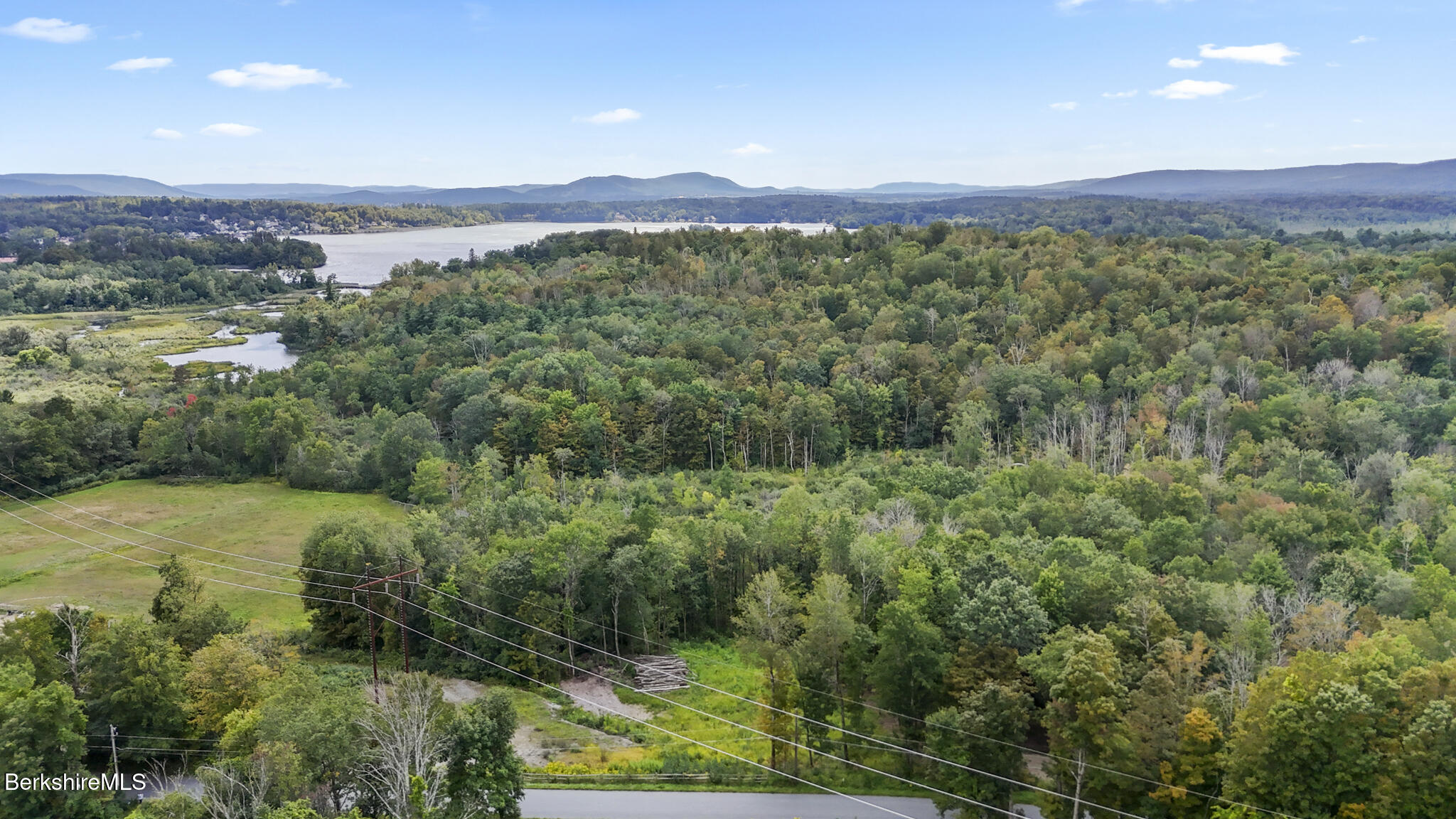 0 Miner Road Lanesborough, MA 01237 - Photo 3 of 10 a view of a lush green hillside and a houses