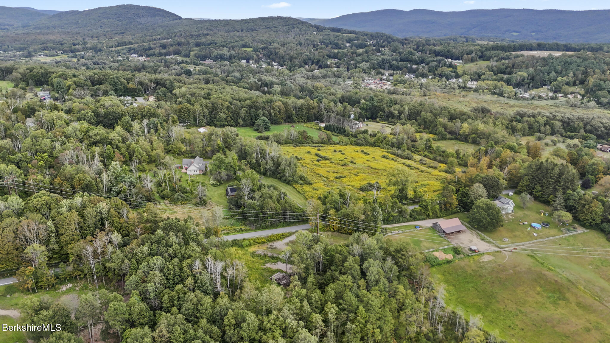 0 Miner Road Lanesborough, MA 01237 - Photo 7 of 10 a view of a lush green hillside and houses